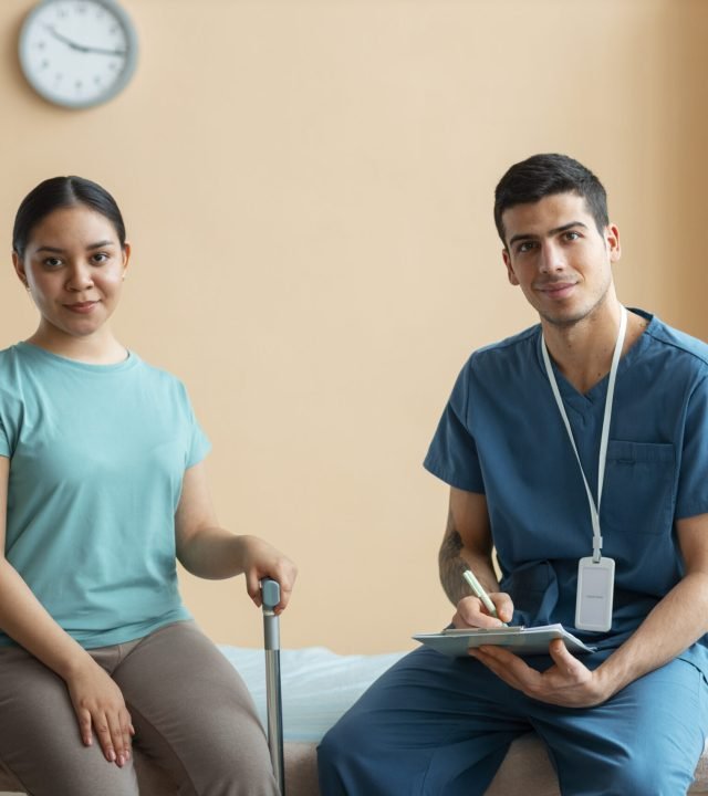 doctor-helping-patient-rehabilitation